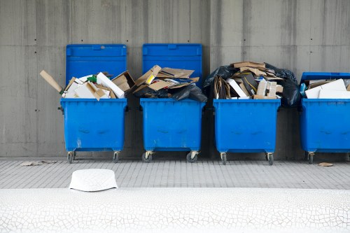 Professionals clearing out a modern Acton flat